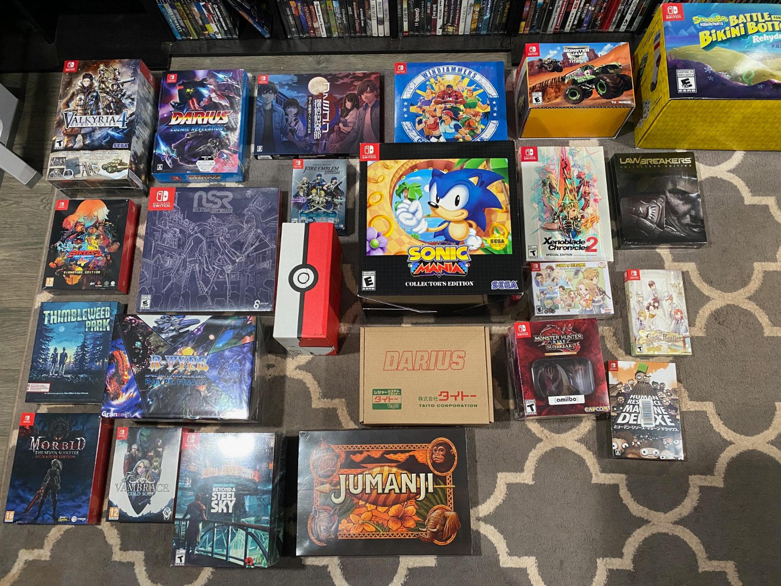 Large Nintendo Switch collector’s editions and boxed releases spread across a rug